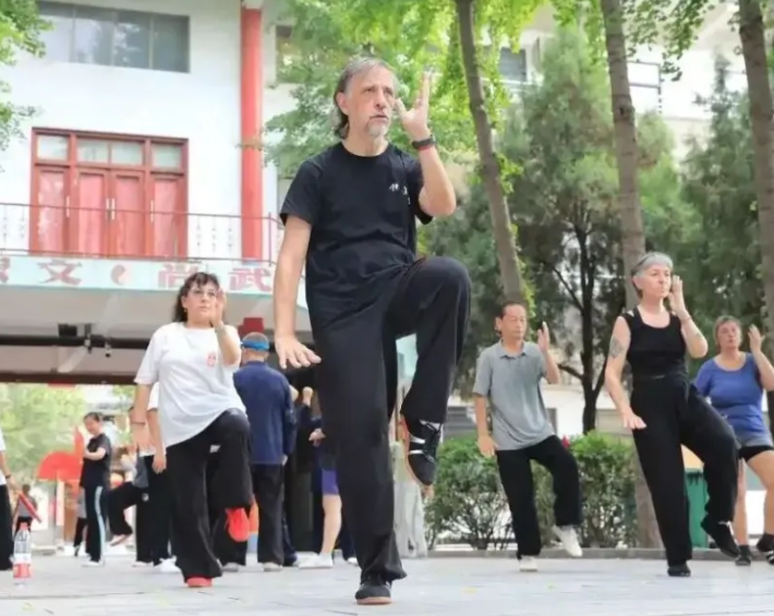 Students learning tai chi together