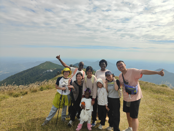 Students at a lookout on a mountain in Guangxi