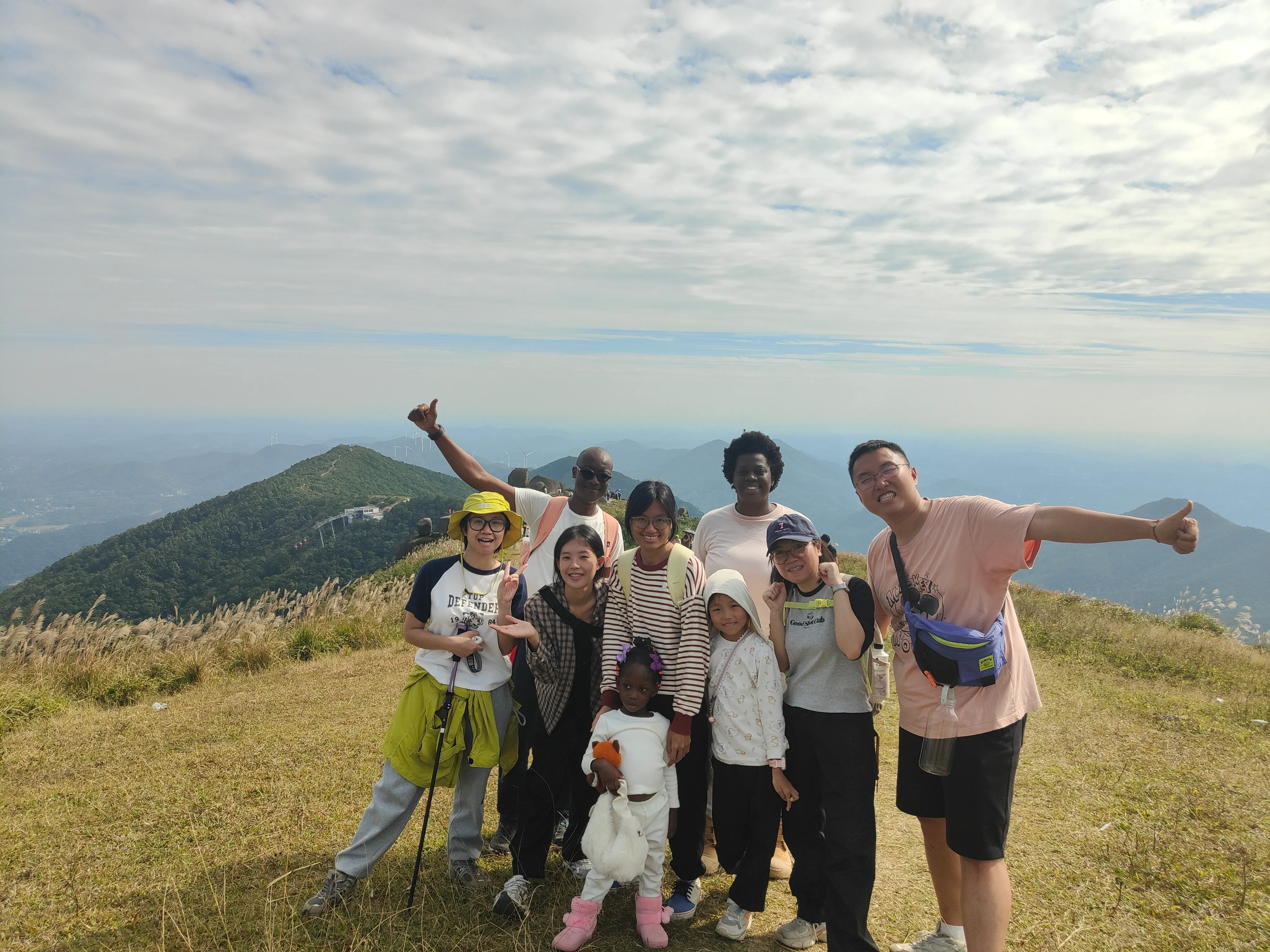 Students reaching the top of a hill on a study trip